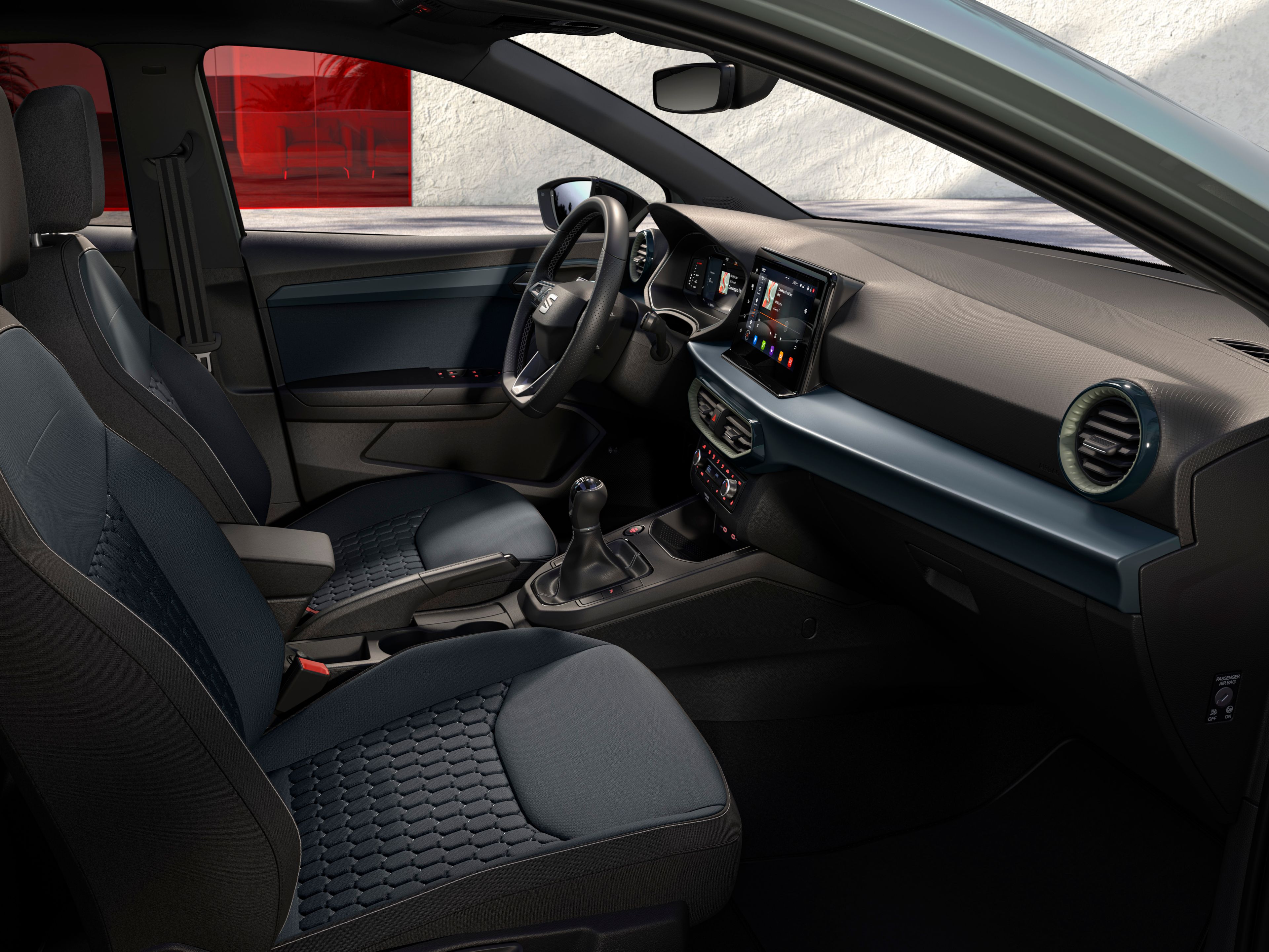 Detaily interiéru modelu SEAT Ibiza vrátane reliéfnych štandardných sedadiel pre verziu Style vo farbe AURORA.