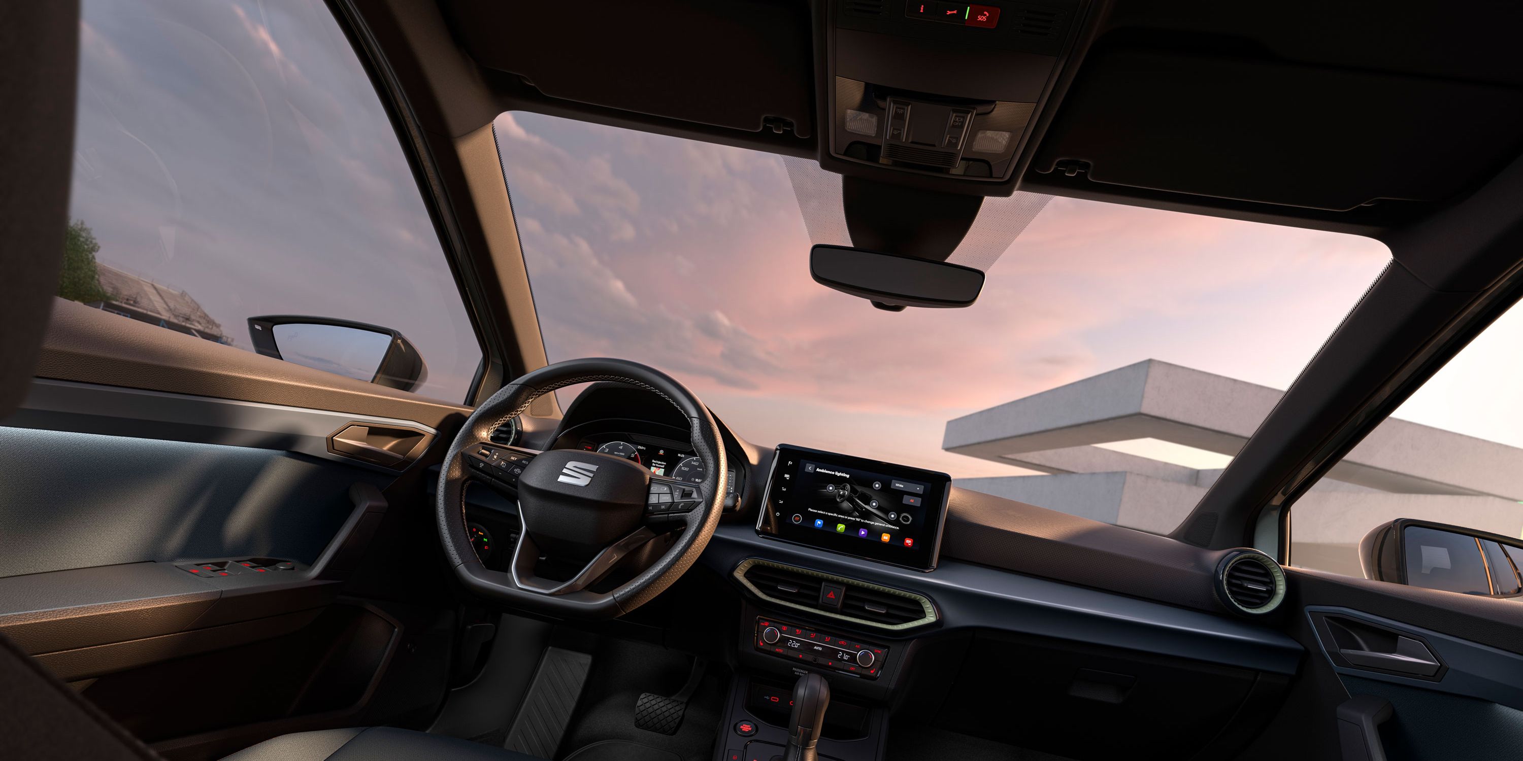 Pohľad na interiér modelu SEAT Arona s dizajnovými detailmi, ako sú volant, palubná doska a čalúnenie.